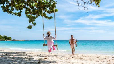 a-couple-of-men-and-woman-at-a-swing-on-the-beach-2025-01-08-22-39-59-utc_(1)